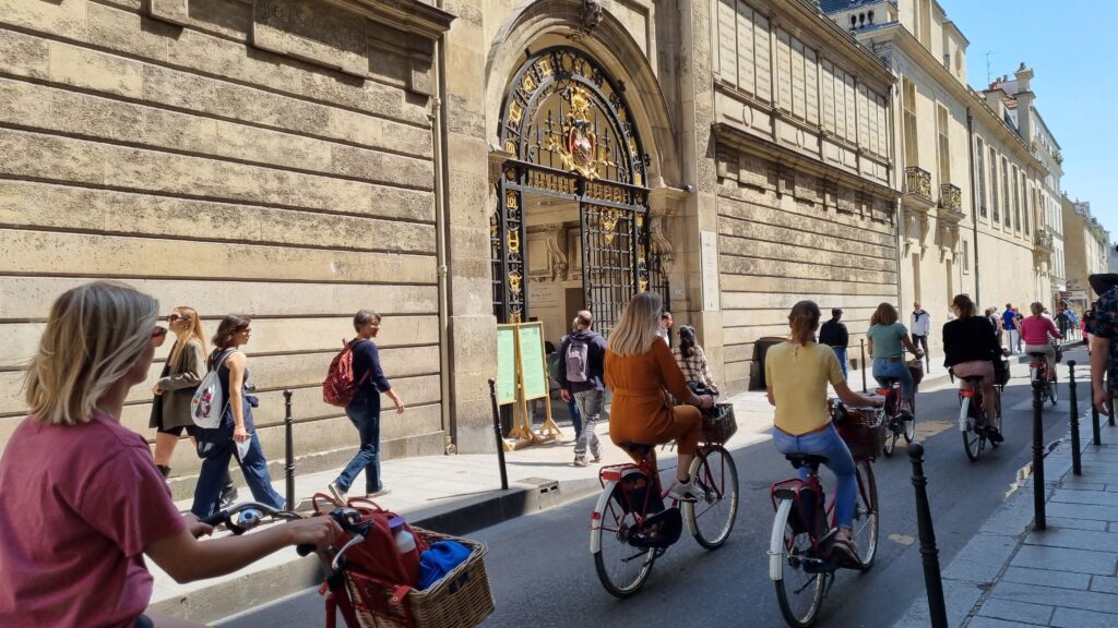 biking-in-front-of-Paris-Musee-Carnavalet-20230526